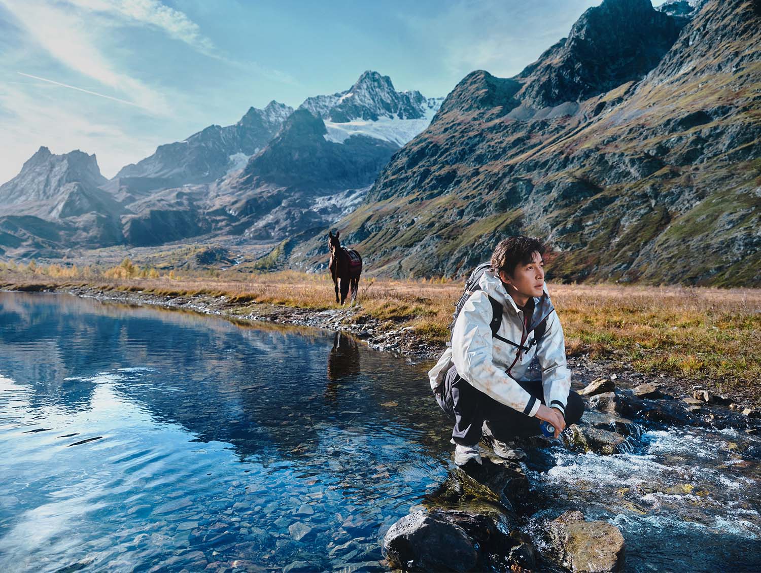 Fashion campaign with horse logistics alpine lake Italy