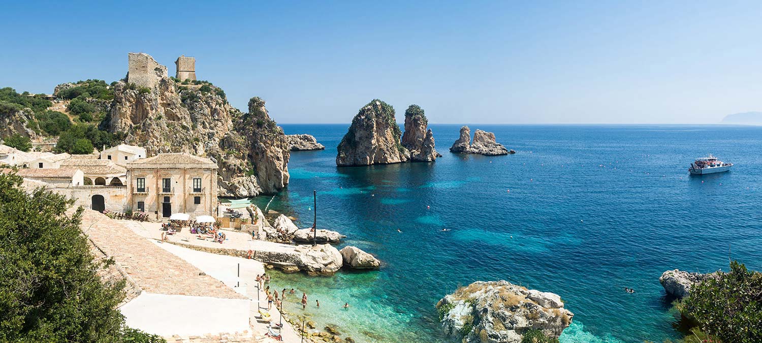 Fashion photo production service in Sicily featuring scopello beach.