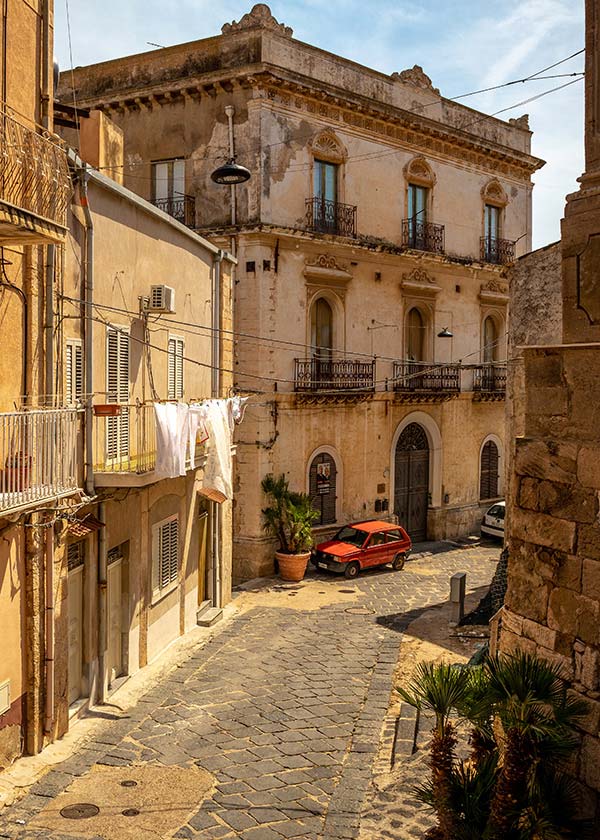 Historic narrow street in Palermo center, showcasing location scouting and production logistics in Sicily