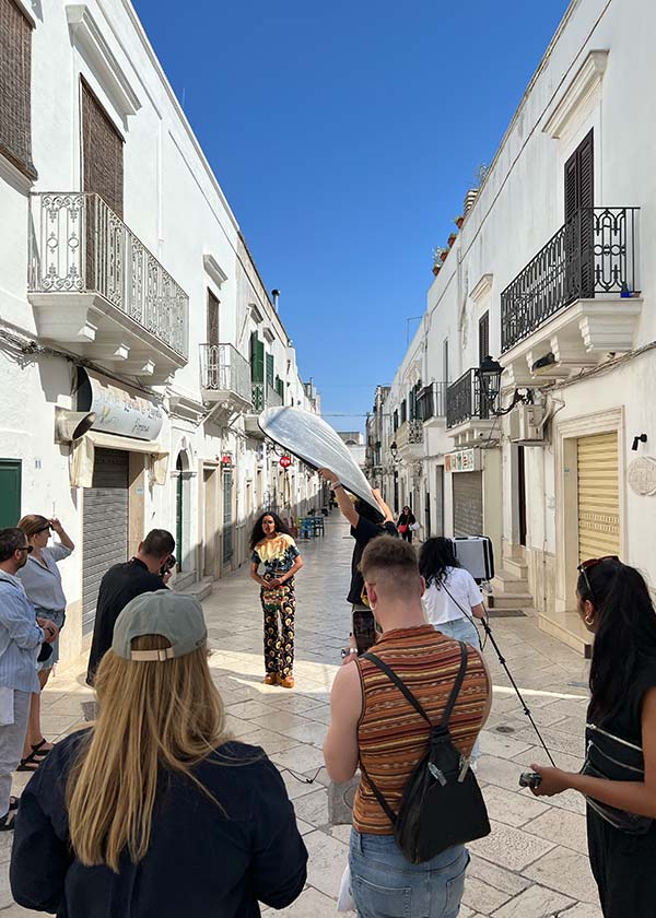 Fashion production crew shooting in the white streets of Ostuni