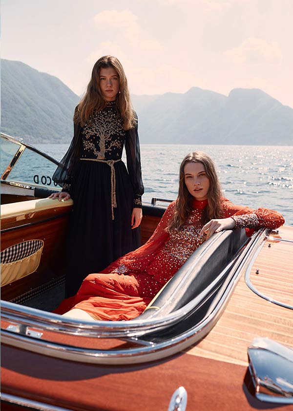 Monique Lhuillier luxury fashion campaign featuring models on a classic Riva picture boat on Lake Como