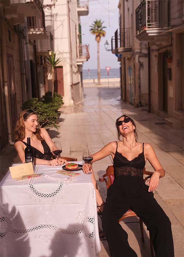 Models in the Cosabella fashion photo campaign, shot in the characteristic whitewashed streets of Polignano a Mare in Puglia