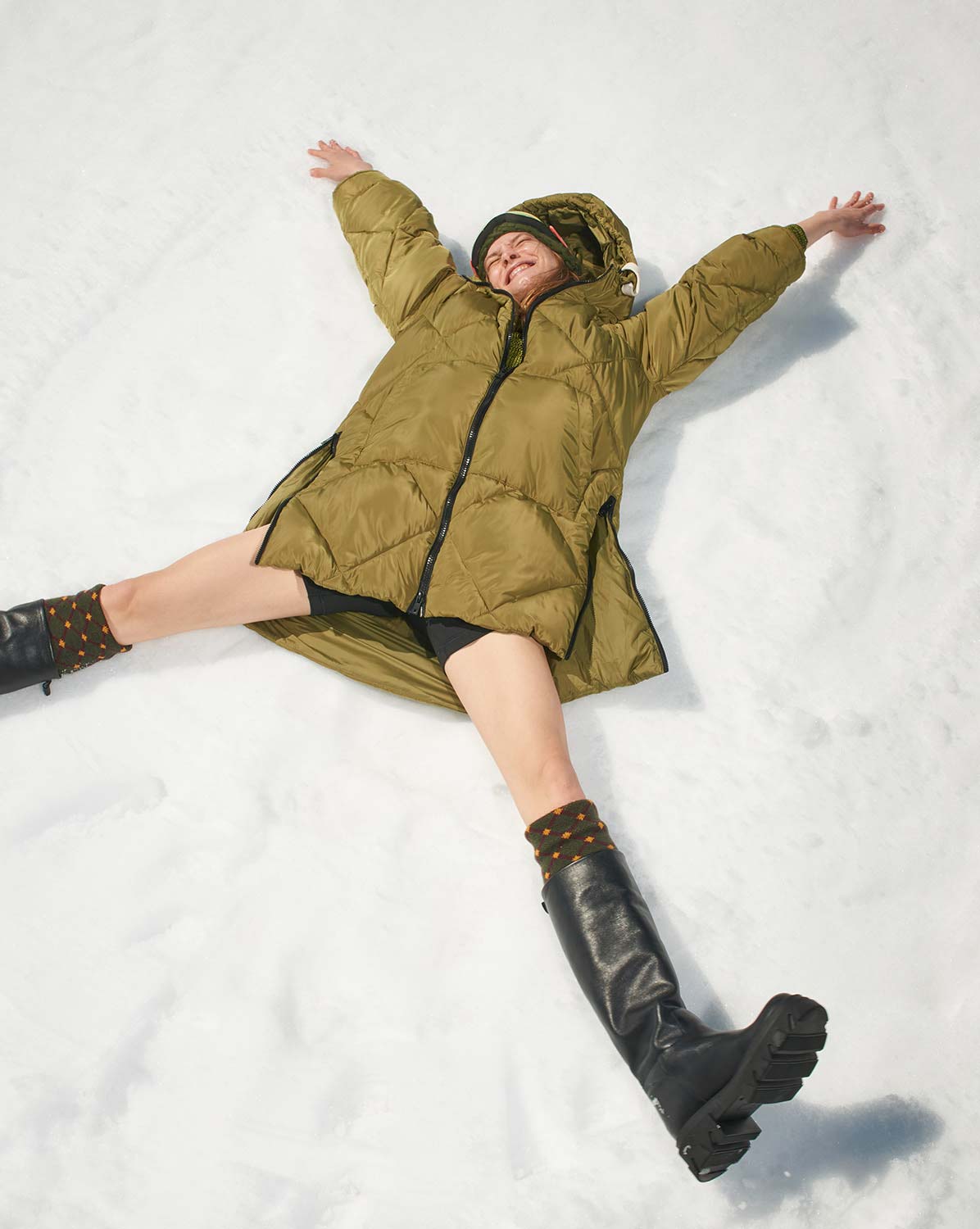 Dual-unit photo and video production crew working efficiently on a snow-covered mountain set