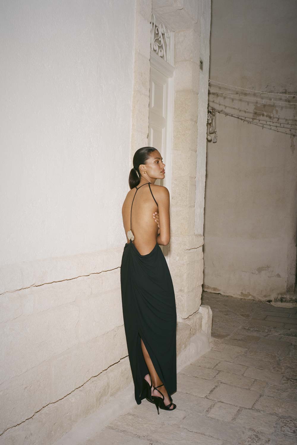 Meshky fashion editorial in a Puglia masseria stone courtyard