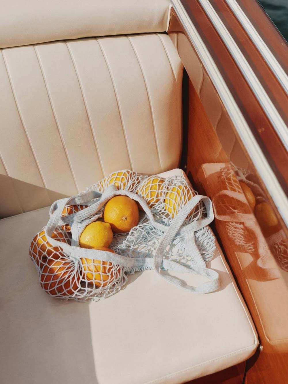 Boden fashion campaign shot on a vintage Riva motorboat on Lake Garda