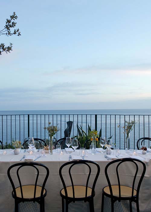 Luxury destination event dinner at a seafront villa in Italy produced by Courage Production